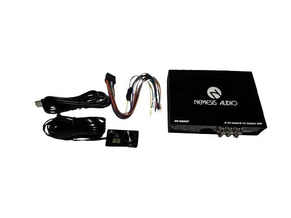 Car audio components including a black box, wiring harness, and cables on a white background.